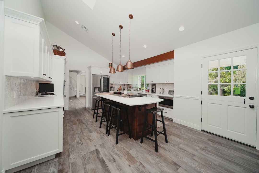 Real estate photographer capturing a property interior — the traditional approach that doesn't scale